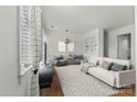 Bright living room featuring modern decor, hardwood floors, and large windows with lots of natural light at 343 Wakefield Dr # C, Charlotte, NC 28209