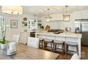 Bright and airy kitchen featuring a marble island, modern lighting, and stainless appliances at 517 Wingrave Dr, Charlotte, NC 28270