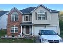 Charming two-story home with brick and vinyl siding and a two-car garage at 5228 Sunriver Rd, Gastonia, NC 28054