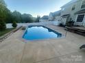 Relaxing backyard pool with concrete surround, perfect for outdoor enjoyment at 5228 Sunriver Rd, Gastonia, NC 28054