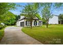 Classic two-story home with attached garage and ample parking space, situated on large lot at 530 Dovefield Dr, Indian Trail, NC 28079