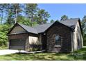 Beautiful single-story home featuring stone and siding details, a dark gray roof, and an attached garage at 6519 Pargo Rd, Charlotte, NC 28216
