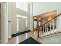 Bright foyer with soaring ceilings, hardwood floors, and staircase leading to second floor at 709 Circle Trace Rd, Monroe, NC 28110