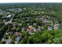 Aerial view of the property located near Carmel Country Club, showcasing the home's setting in a lush, green neighborhood at 7409 Stonecroft Park Dr, Charlotte, NC 28226