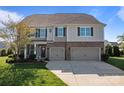 Beautiful two-story home with brick accents, a two-car garage and landscaped front yard at 7693 Lazy Hollow Ln, Denver, NC 28037