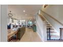 Bright, open-concept living room featuring hardwood floors and a staircase to the second level at 1511 Landis Ave, Charlotte, NC 28205