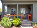 Inviting front porch with seating area, providing a relaxing outdoor space at 1511 Landis Ave, Charlotte, NC 28205