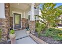 Inviting front porch with stone accents, lush landscaping, and a welcoming entrance at 15127 Oleander Dr, Charlotte, NC 28278