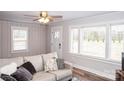 Inviting living room with hardwood floors, neutral walls, and a comfortable sofa filled with decorative pillows at 2693 Salem Church Rd, Lincolnton, NC 28092