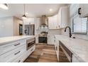 Modern kitchen with white cabinets, stainless steel appliances, and a center island at 28647 Nc Hwy 73 Hwy, Albemarle, NC 28001