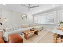Bright living room featuring hardwood floors, neutral walls, contemporary furnishings, and a large window for ample natural light at 3423 Sudbury Rd, Charlotte, NC 28205