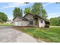 A charming, single-story stucco home with a stone-accented entrance and a well-kept lawn at 3764 Glenn Oaks Dr, Maiden, NC 28650