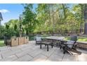 Backyard patio area with outdoor seating, landscaping and fire pit at 4012 Brandywine Ter, Lancaster, SC 29720