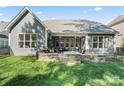 Exterior view of backyard, highlighting patio with fire pit and grilling area at 4012 Brandywine Ter, Lancaster, SC 29720