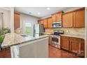 Well-equipped kitchen with stainless steel appliances and granite countertops at 4648 Craigmoss Ln, Charlotte, NC 28278