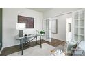 Bright office with a glass desk, comfortable seating, and French doors leading to another room at 5232 Reedy Ridge Rd, Charlotte, NC 28215