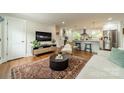 Open-concept living area blending a cozy living room with a modern, well-equipped kitchen at 6339 Montpelier Rd, Charlotte, NC 28210
