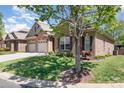 Charming brick home featuring a two-car garage, a well-manicured lawn, and decorative shutters at 106 Independence Ct, Kings Mountain, NC 28086