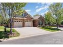 Charming brick home featuring a two-car garage and a well-manicured lawn on a tree-lined street at 106 Independence Ct, Kings Mountain, NC 28086