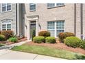 Landscaped front yard features lush greenery, decorative bushes, and a well-maintained lawn at 11447 Potters Row, Cornelius, NC 28031
