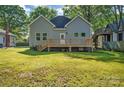 Exterior showcasing a spacious backyard with a wooden deck, perfect for outdoor entertaining at 126 Hemphill Ave, Chester, SC 29706