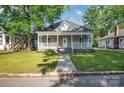 Charming home with inviting front porch and a well maintained front lawn at 126 Hemphill Ave, Chester, SC 29706