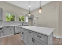 Modern kitchen with gray cabinetry, white marble countertops, pendant lighting, and stainless steel appliances at 126 Hemphill Ave, Chester, SC 29706