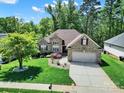 Expansive aerial view of a brick home with lush greenery and a well-maintained lawn at 1589 Essex Hall Dr, Rock Hill, SC 29730