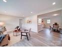 Open-concept layout with spacious living room flowing into dining area and kitchen at 163 Briarcliff Dr, Kannapolis, NC 28081
