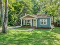 Attractive single-story home with a well-manicured lawn and inviting curb appeal, great setting at 1720 Chatham Ave, Charlotte, NC 28205