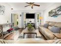 Bright living room featuring hardwood floors, a large window, and neutral decor at 201 Olde Coach Ln, Crouse, NC 28033
