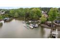Aerial view of a lakeside community featuring boat docks and tranquil water views at 263 Fernbrook Dr, Mooresville, NC 28117