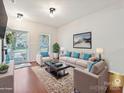 Inviting living room with neutral décor, hardwood floors, and a view of the front door at 2731 Meadow Knoll Dr, Charlotte, NC 28269