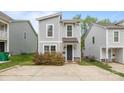 Charming two-story home featuring a gray siding, stylish windows, and a well-manicured front yard at 2821 Shamrock Dr, Charlotte, NC 28205