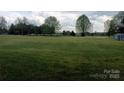 Expansive backyard with mature trees, providing privacy and space for outdoor activities at 4330 Goodman Lake Rd, Salisbury, NC 28146