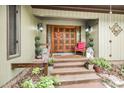 Inviting front entrance with double doors, decorative lanterns, and beautiful plants at 78 N Scalybark Trl, Concord, NC 28027