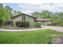 A charming house with stone and siding, complemented by a lush green lawn at 78 N Scalybark Trl, Concord, NC 28027