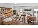 Bright living room showcasing a sectional couch, a patterned rug and modern decor at 805 Gunnar Dr, Gastonia, NC 28054