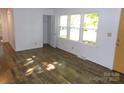 Sunlit living room with hardwood floors, offering a view of the neighborhood through the window at 906 N 11Th St, Albemarle, NC 28001