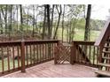 Wooden deck and railing offer a serene outdoor living space with wooded views at 948 Kingswood Dr, Rock Hill, SC 29732