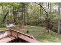 Relaxing backyard view with mature trees, shed, and natural surroundings, perfect for privacy at 948 Kingswood Dr, Rock Hill, SC 29732