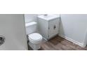 Compact powder room with white vanity, modern fixtures, and stylish flooring at 948 Kingswood Dr, Rock Hill, SC 29732
