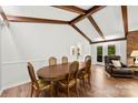 Dining room with wood floors and exposed beams, perfect for Gathering gatherings at 1012 Woodlark Ct, Gastonia, NC 28056
