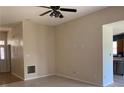 Open-concept living room featuring neutral paint, adjacent kitchen, and ample natural light at 12031 Brownestone View Dr, Charlotte, NC 28269