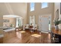 Bright and airy foyer featuring gleaming hardwood floors and soaring ceilings at 12122 Camden Trail Ct, Charlotte, NC 28277