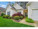 Charming home featuring lush landscaping around the front entrance at 13505 Michael Lynn Rd, Charlotte, NC 28278