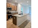 Modern kitchen with stainless steel appliances, granite countertops, and a kitchen island at 2219 Catawba Trace Dr, Catawba, NC 28609