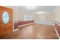 Inviting living room featuring hardwood floors, built-in cabinets, and ample natural light at 2582 Ivey Church Rd, Lincolnton, NC 28092
