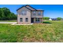 Attractive home with a stylish exterior, neat landscaping, and a welcoming front entrance at 3012 Isle Ln, Monroe, NC 28110