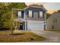 Well-maintained home with a two-car garage, and a welcoming front porch at 320 Silver Oak Cir, Rockwell, NC 28138
